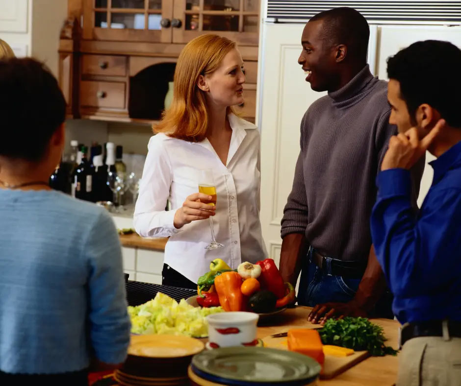 People eat and drink at a party. 